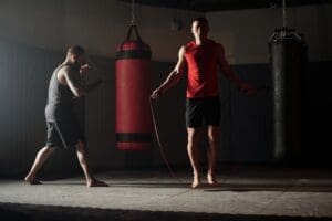 Instructor leading cardio kickboxing class at Morris County Wrestling & Martial Arts helping students burn fat and lose weight