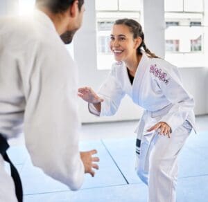 Female martial arts student practicing BJJ and Muay Thai for self-defense in Morris County NJ gym