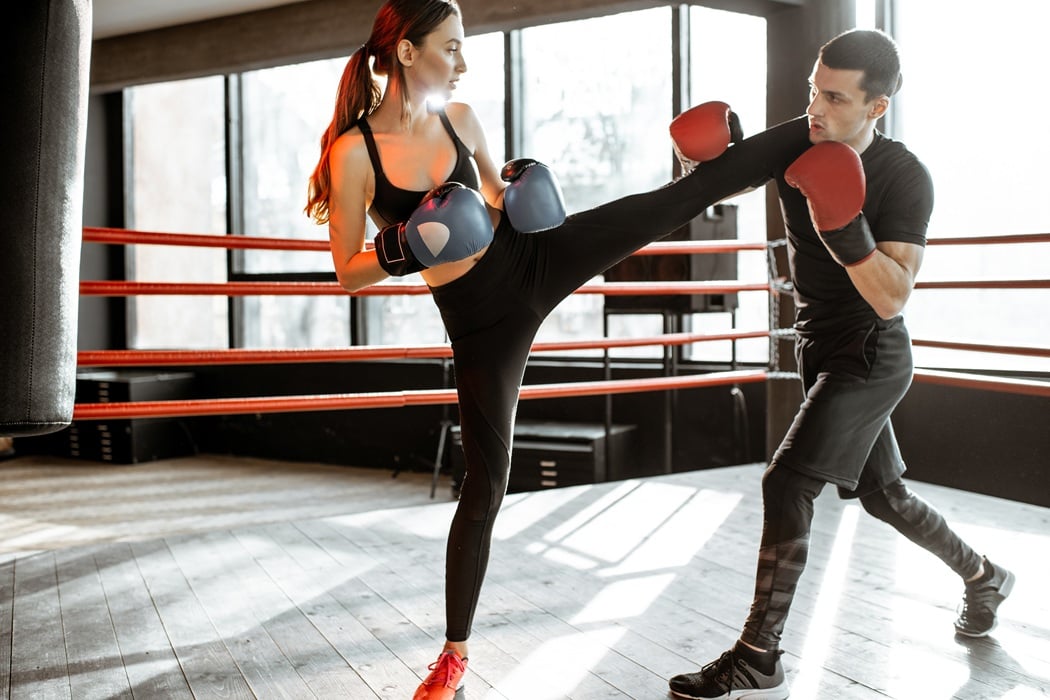 Young woman training Cardio kickboxing at Morris County Wrestling & Martial Arts